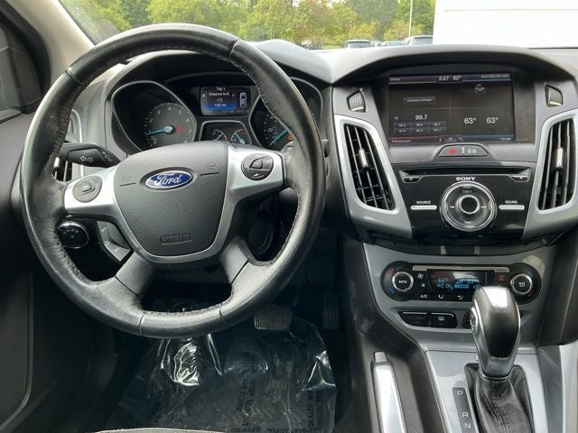 Used 2014 Ford Focus Titanium with VIN 1FADP3J20EL116597 for sale in Flint, MI